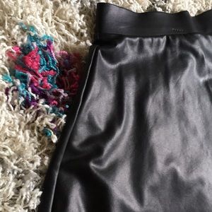 Black spandex/polyester skirt.